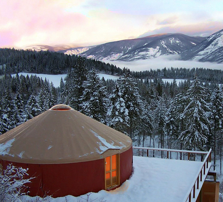 30' Yurt on mountain top surrounded by snow